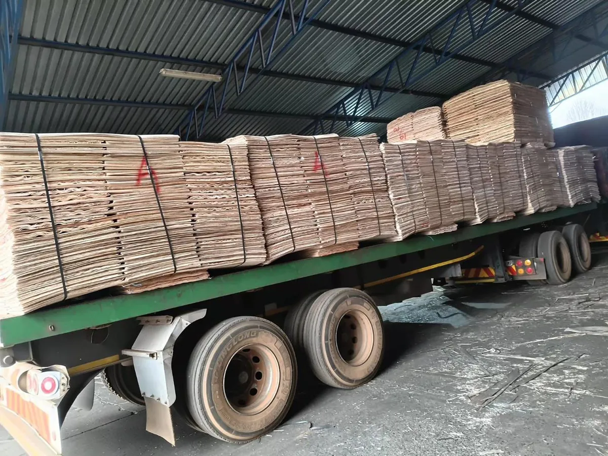 Eucalyptus core veneer bundles stacked on a flatbed in the warehouse